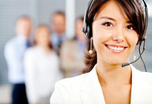 Image of a woman and a team of professional answering service agents