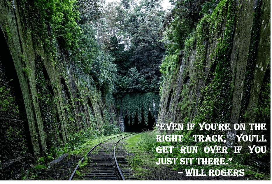 Image of train tracks leading into a tunnel with a quote by Will Rogers